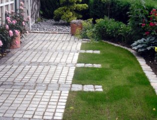 Iljas Gartenbau und Landschaftsbau Neuhausen Granitsteinpflasterterrasse mit Rollrasenverlegung